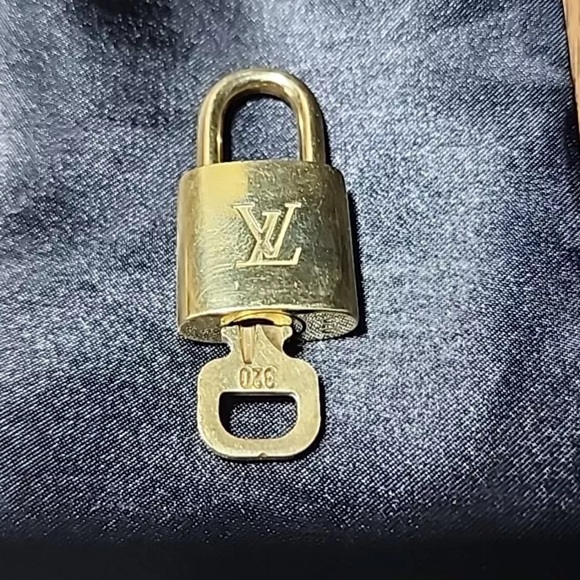 Louis Vuitton Other - Authentic Louis Vuitton 320 lock and key LV